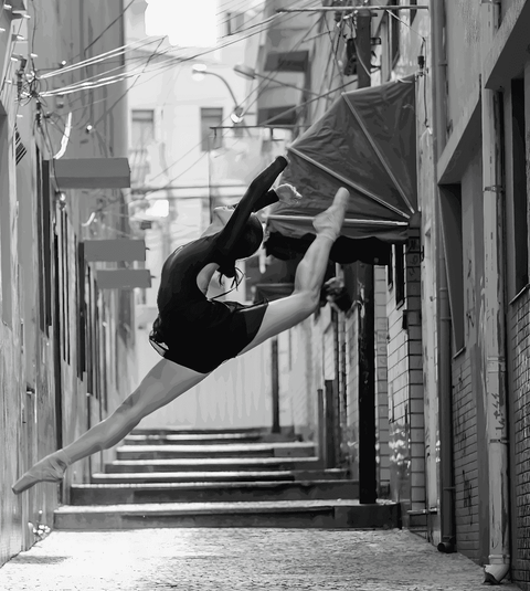 Ballet Dancer Amidst Urban Landscape in Black & White - Luminous Crystal Porcelain Framed Art Print - Furnt
